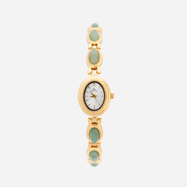 Clara – Goldene Uhr mit länglichem Zifferblatt.