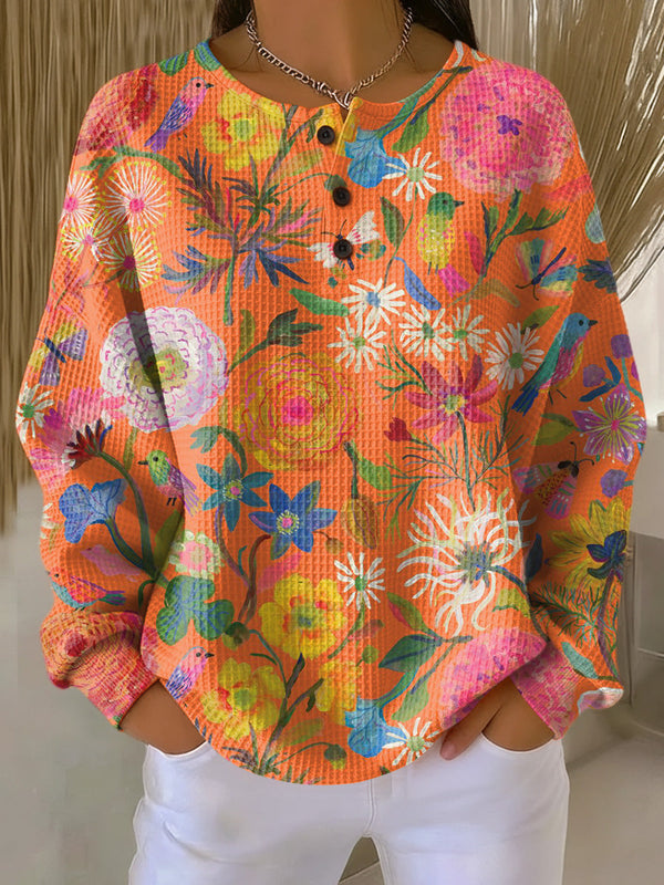 Isabel™ | Oranger Pullover mit Blumenmuster