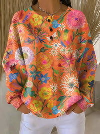 Isabel™ | Oranger Pullover mit Blumenmuster