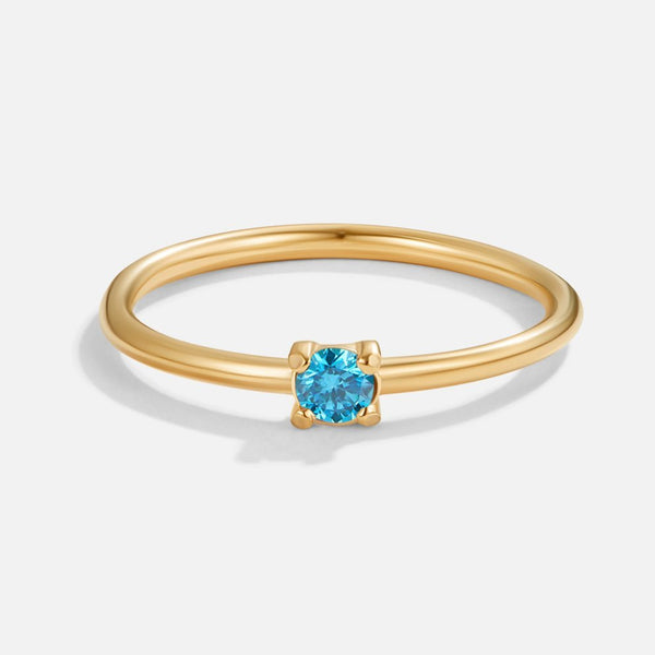 Noelle – Feiner Goldring mit blauem Kristall